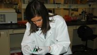 Assistant Professor Irene Salinas examines a research sample. 